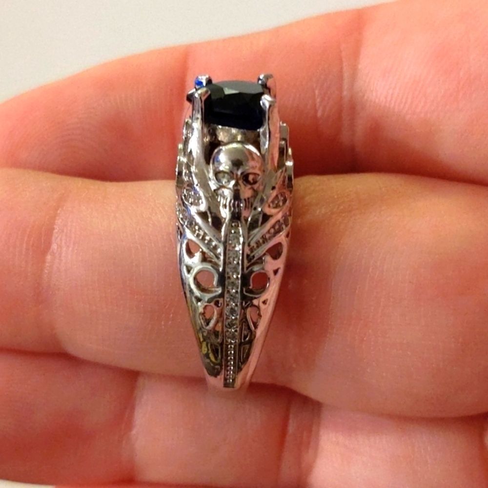 Unisex
- Sterling Silver Stamped - Simulated Blue Heart - Skeleton Ring